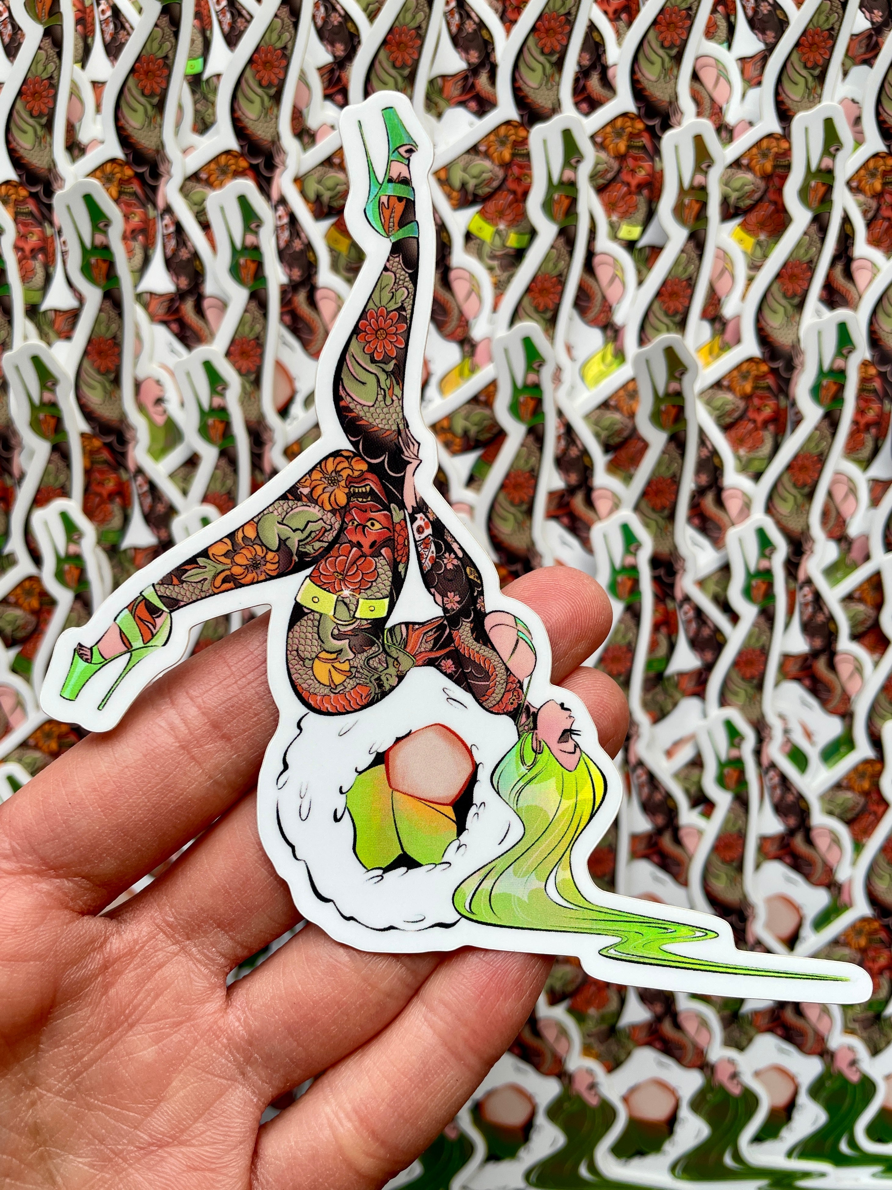 tattooed woman on top of california roll sushi holographic vinyl sticker by bloodknotcollective