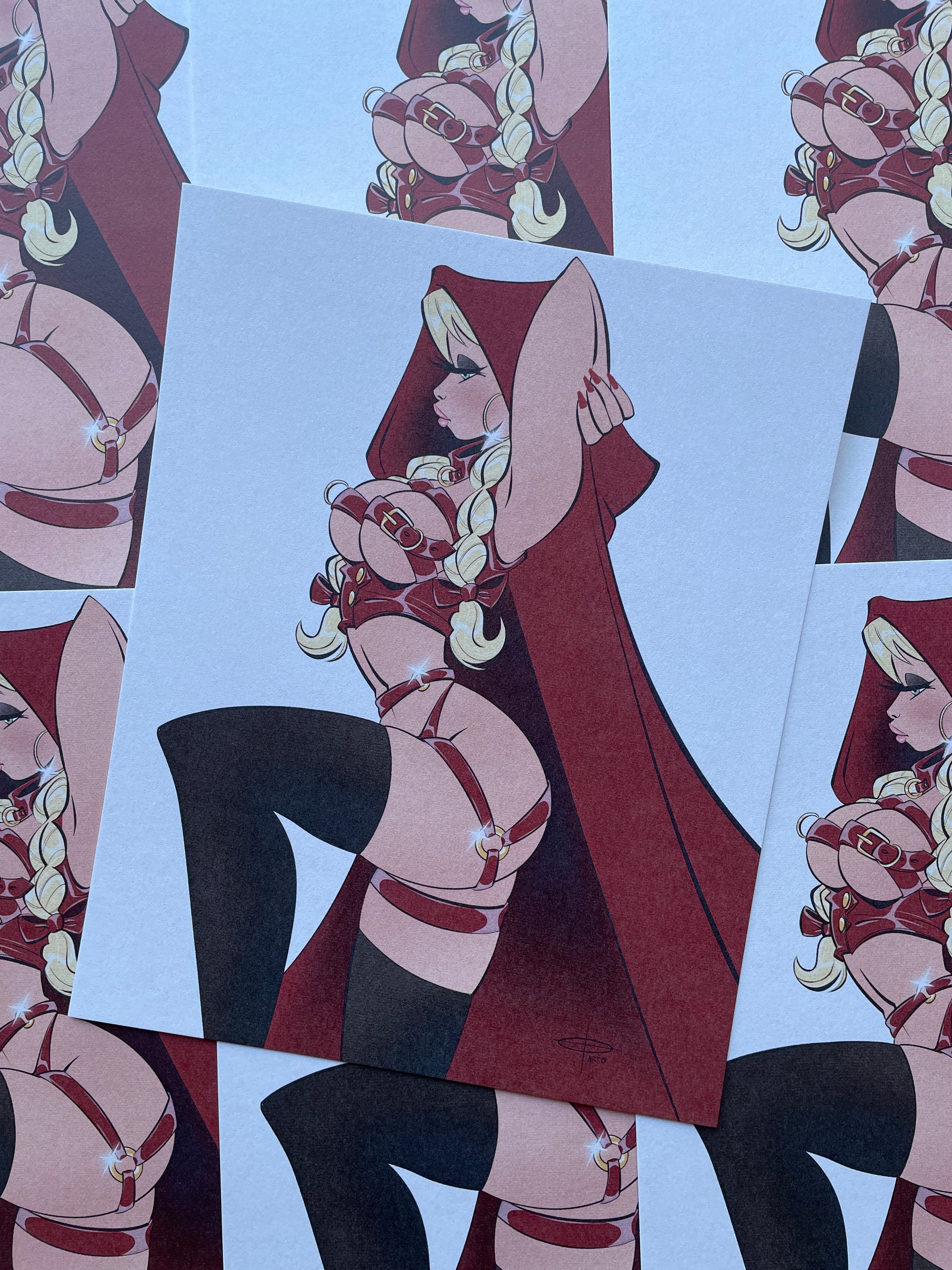 little red print of women in lingerie and cape by bloodknotcollective