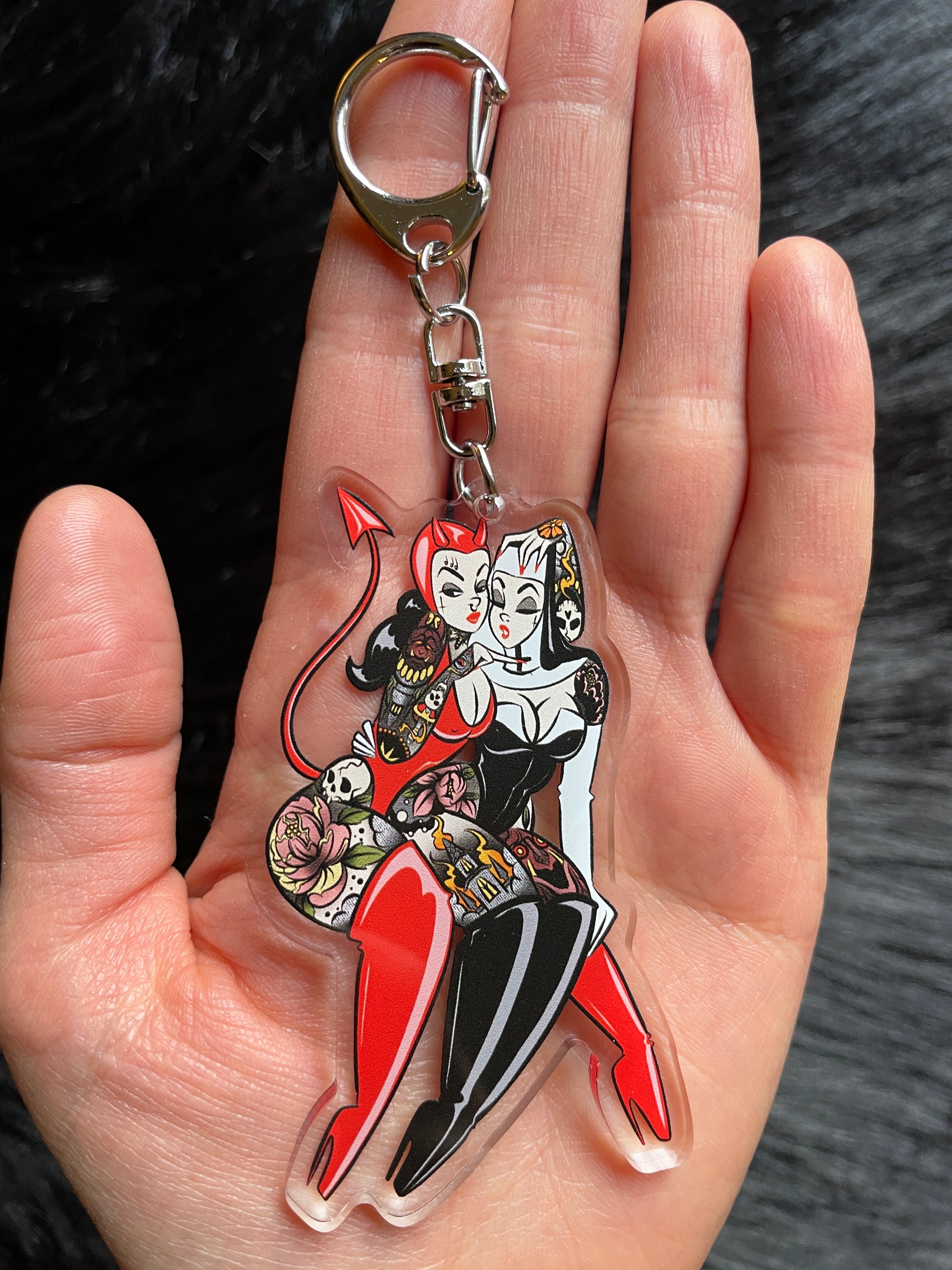wicked game keychain of tattooed devil and nun keychain
