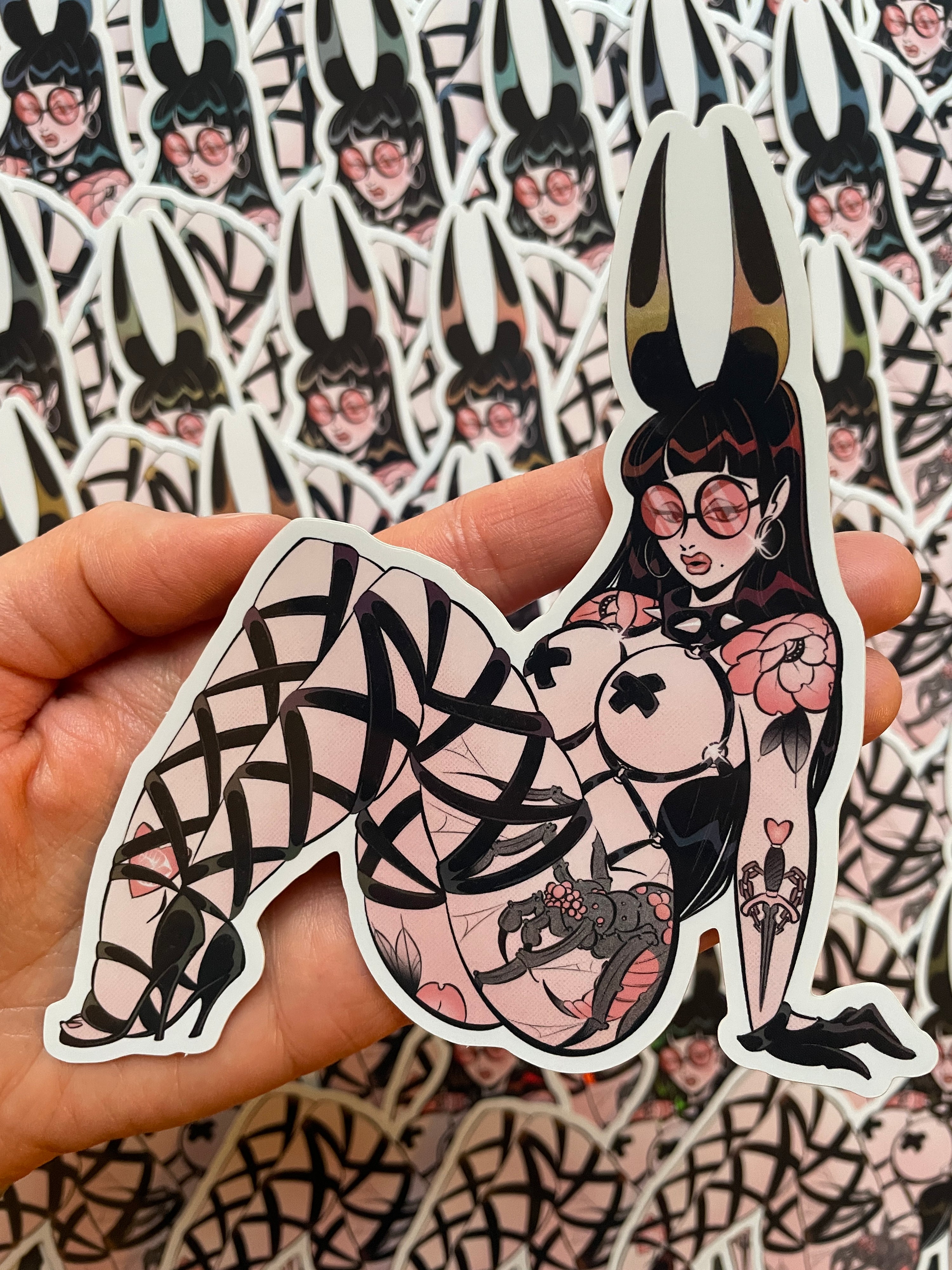 goth pinup with bunny ears and tattoos holographic vinyl sticker by bloodknotcollective