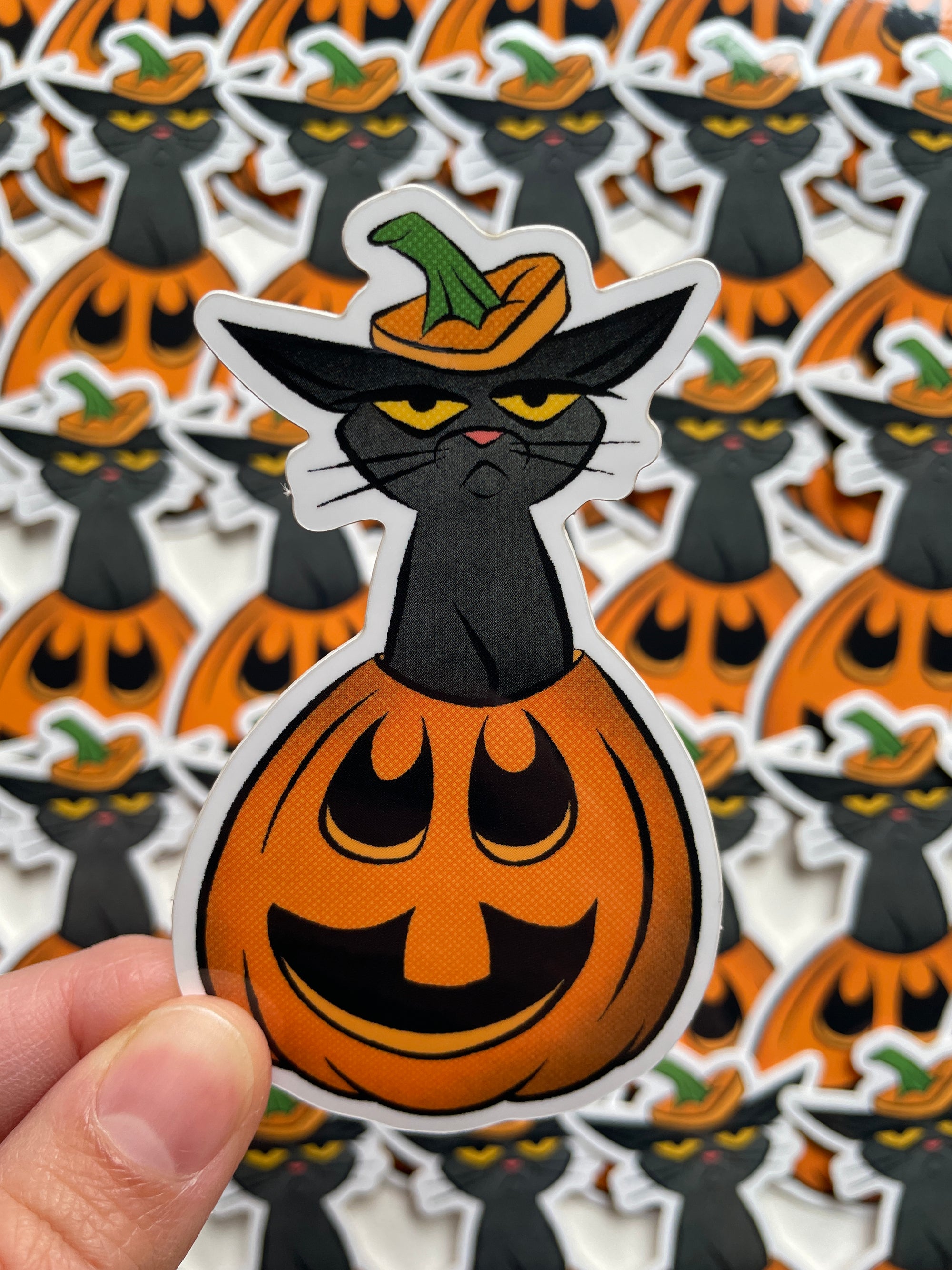grumpy kitty sticker of black cat in pumpkin