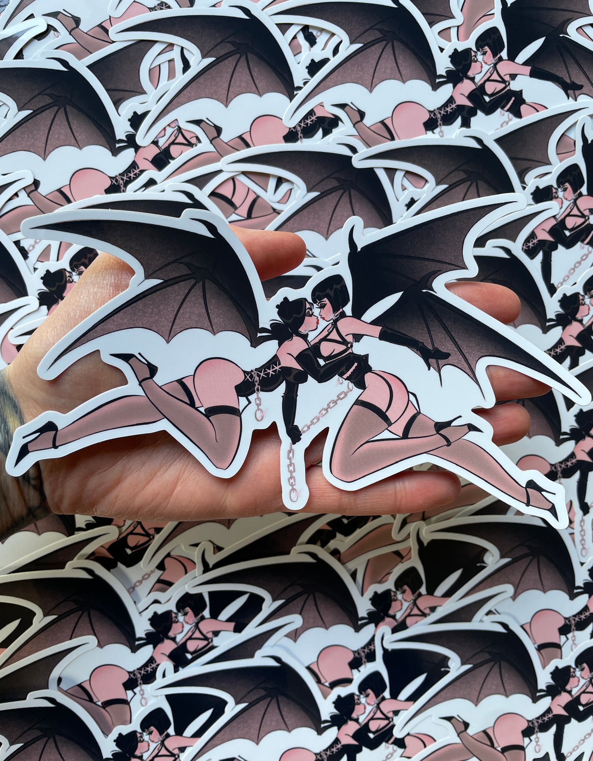 two lesbian gothic bat pinups holographic vinyl sticker by bloodknotcollective