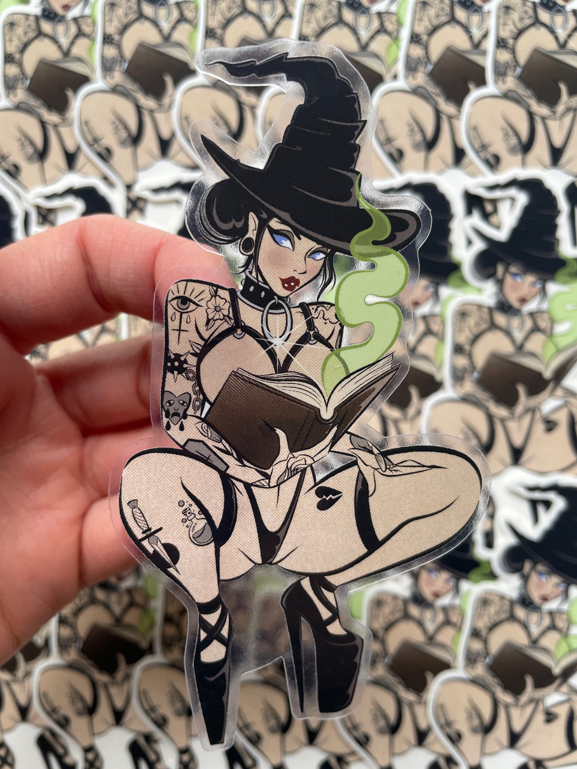 tattooed witch with book and magic clear vinyl sticker by bloodknotcollective