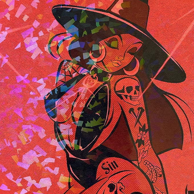 close up of red witch with tattoos on holographic paper