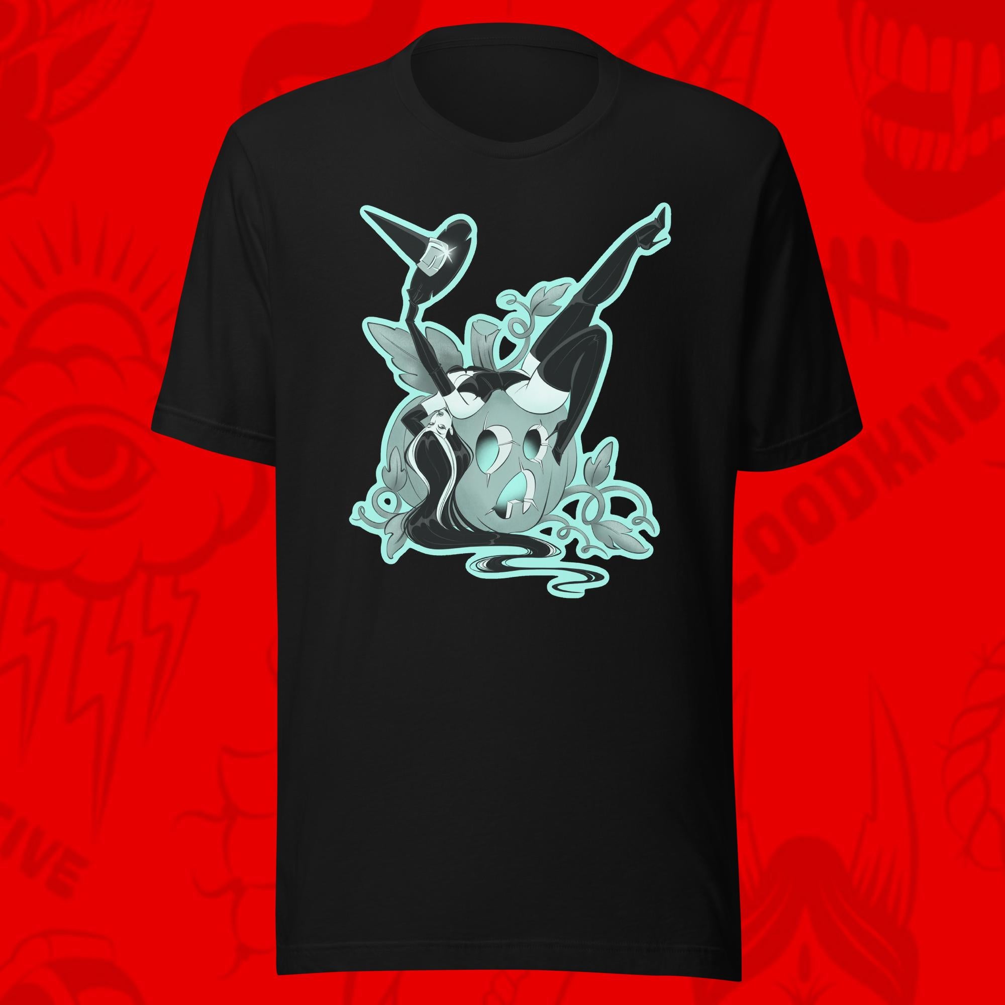 season of the witch of woman leaning over pumpkin on black tee by bloodknotcollective